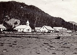 The community of Kingcolith on the Nass River, 1881. The row housing to the right of the photo is the same type of housing that can be seen at Metlakatla. American Museum of Natural History