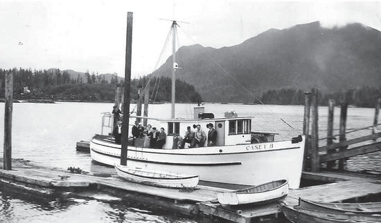 A light-coloured boat travelling across the water