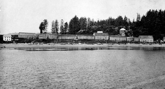 Photo of Yuquot, beach and buildings.