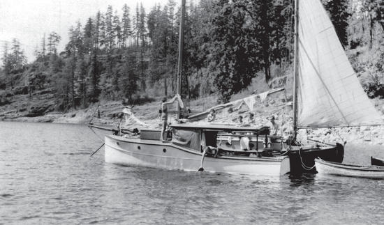 The Caprice alongside a sailboat with a few of the children visible on board
