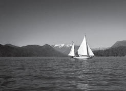 Fearing the weather in Knight Inlet, Capi and her crew hitched a ride on a passing sailboat.
