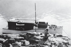 Several of the children lying on a rock as if suntanning