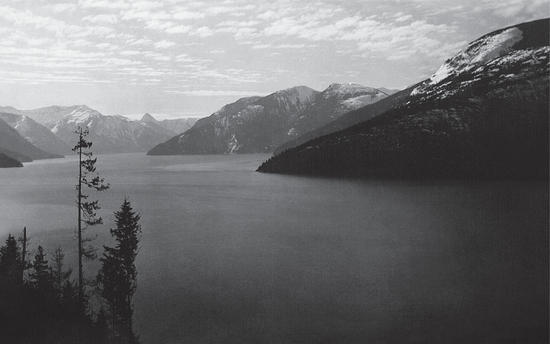 A view of ocean below, with land in the distance