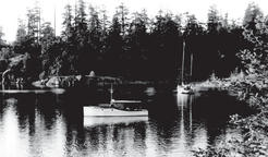 A small white motorboat in a bay