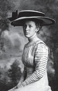 A portrait ofa young Capi wearing an ornate hat