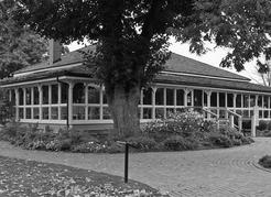 Guisachan House has undergone several renovations and restorations in the intervening years, and is currently a restaurant. The two and a half acres of Edwardian gardens surrounding the building were first planted by Elaine Cameron, who, with her husband Paddy, purchased the property from the Aberdeens. Mrs. Cameron kept meticulous journals and photographs of her plantings, which were used to reconstruct the garden. The main entrance to the house was originally through the avenue of cedars to the north. It has been said that on a clear moonlit night, the clip-clop of the horse carriages that long ago visited the house can still be heard. The square-cut log house on the property originally belonged to John McDougall, and was built in 1886; it was moved onto the site in the 1980s. The Guisachan buildings and garden are off Cameron Avenue. | Stuart Kernaghan, xyphotos.ca