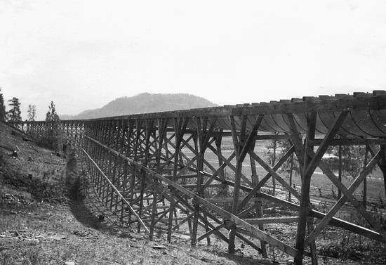 A large, long structure supported by wooden beams.