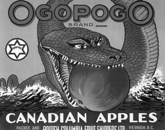 An illustration of a sea serpent with an apple in its mouth. It is on a body of water. Text: Ogopogo Brand Canadian Apples  
