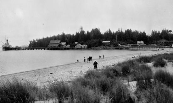 Vancouver photographer Frank Leonard took this photograph in the 1920s. The saltery stands at the end of the dock, and Walter Dawley’s store, with its square white front, on the far right. The Clayoquot Hotel, rebuilt after the fire of 1922, is the dark building to the left of the store. The European beach grass in the foreground, brought in by Dawley to firm up the sandy beach, proved to be invasive and damag-ing, spreading to other beaches in the area.