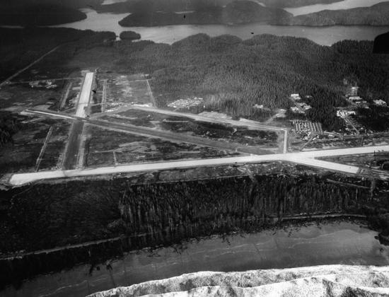 The Tofino Air Base under construction in late 1942, with the waves of Long Beach and the Tofino-Ucluelet road visible in the lower section of the photo. The aircraft hangars had yet to be built but most administrative buildings appear to be completed, including the 128-bed hospital, a recreation hall, a canteen, a thirteen-bay garage, barracks, a diesel power plant, and mess halls. Over 2,000 air force servicemen and eighty members of the Women’s Division served at the Ucluelet and Tofino bases during World War II.