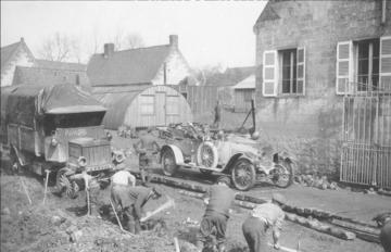 Men laying down corduroy road