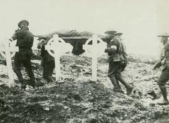 Wounded at Passchendaele—the bodies of British Columbians killed at the front never made it home. Many were buried where they fell. Carrying wounded at Passchendaele, CWM 19930013- 477, George Metcalf Archival Collection, © Canadian War Museum