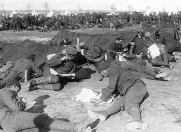 Photo of soldiers reading