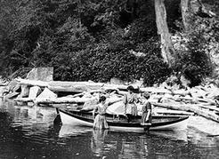 Three young women bathing at a secluded beach on the North Shore, ca. 1910. NVMA 4019