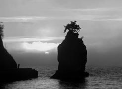 Siwash Rock and seawall on the western tip of Stanley Park. The 10-kilometre seawall promenade around the park’s perimeter, started in 1917 and completed in 1980, has become a major recreation resource for residents and visitors&#160;alike. David Nunuk&#160;photo