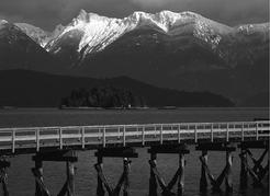 Looking across Howe Sound at the Mainland mountains from Hopkins Landing, near Gibsons. The drops from mountaintop to sea floor along the Strait’s Mainland shore are some of the greatest in North&#160;America. Dean van’t Schip&#160;photo